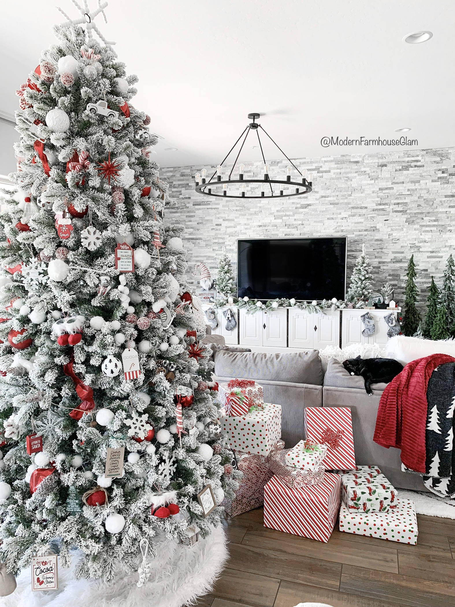 Flocked white Christmas tree with all white and silver decorations